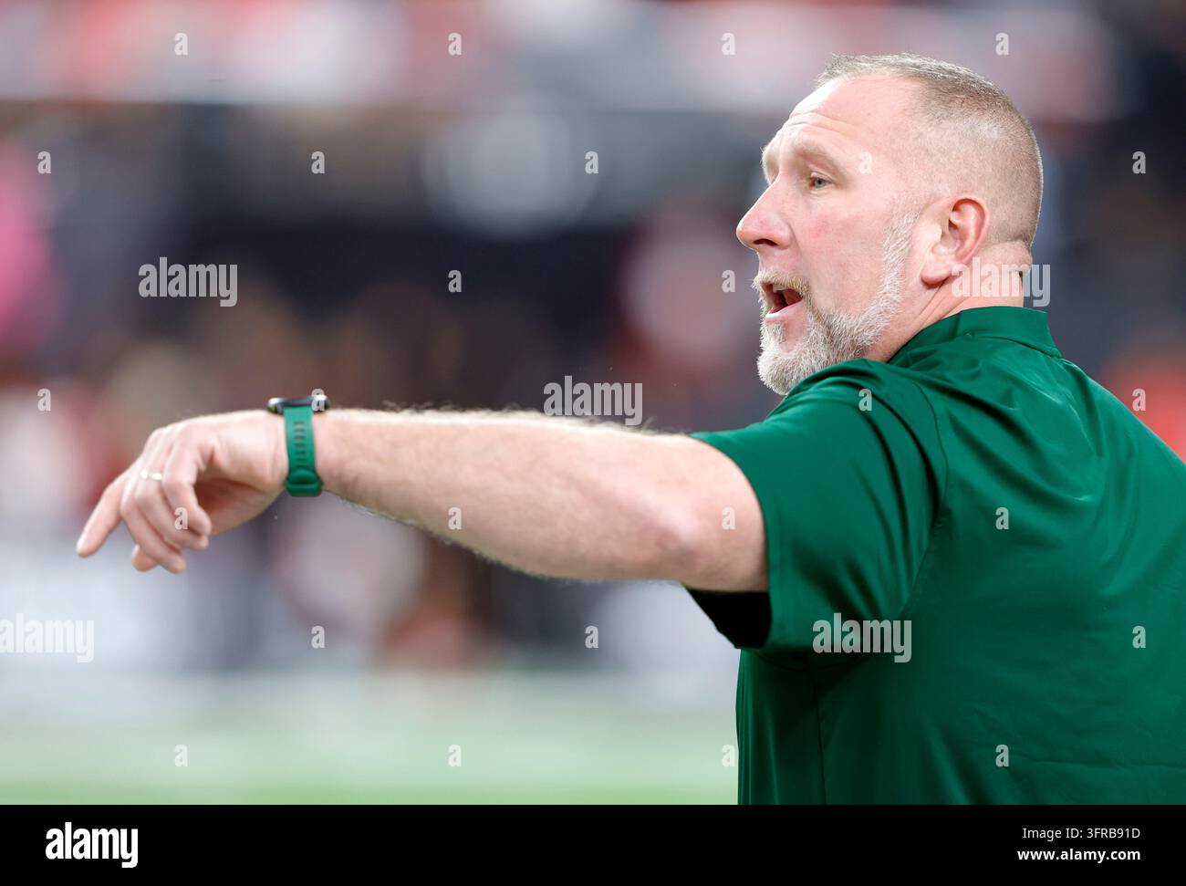 North Dakota State head coach Tim Polasek watches players during ...