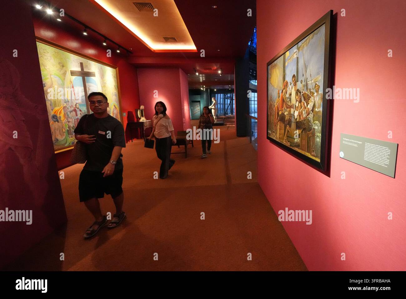 Visitors look at the displays at the Museo del Galeon in Manila ...