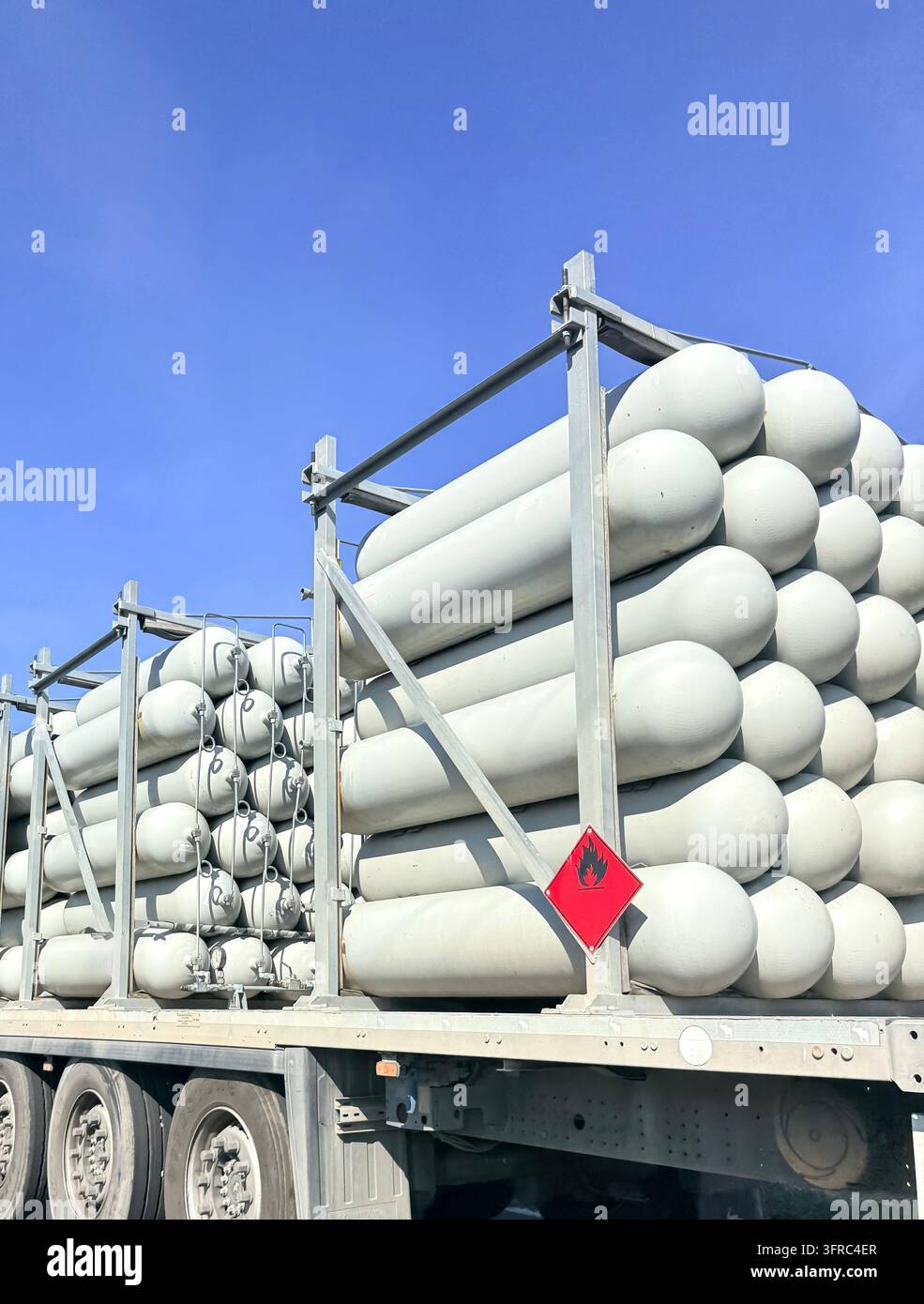 Heavy industrial steel pipes for gas transportation loaded on a cargo truck platform in Burgas. - Smartphone Captured Stock Image