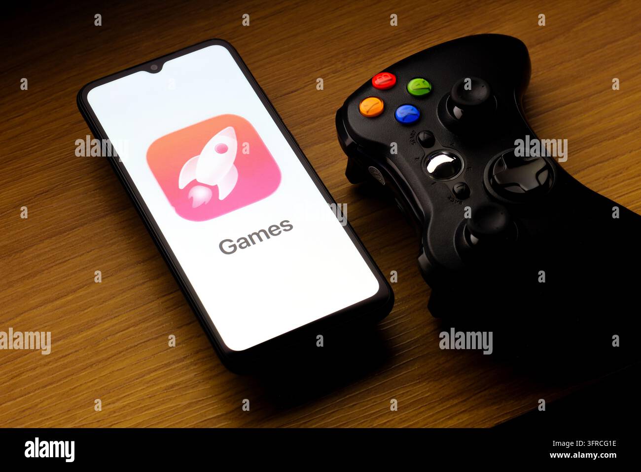 In this photo illustration, the Apple Games logo is seen displayed on a ...