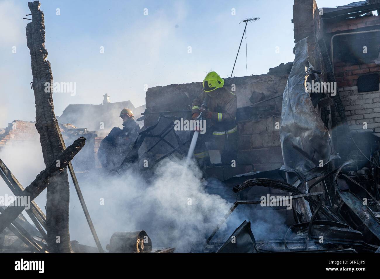 File Rescue Software Rescue workers put out a fire of residential houses destroyed in a ...