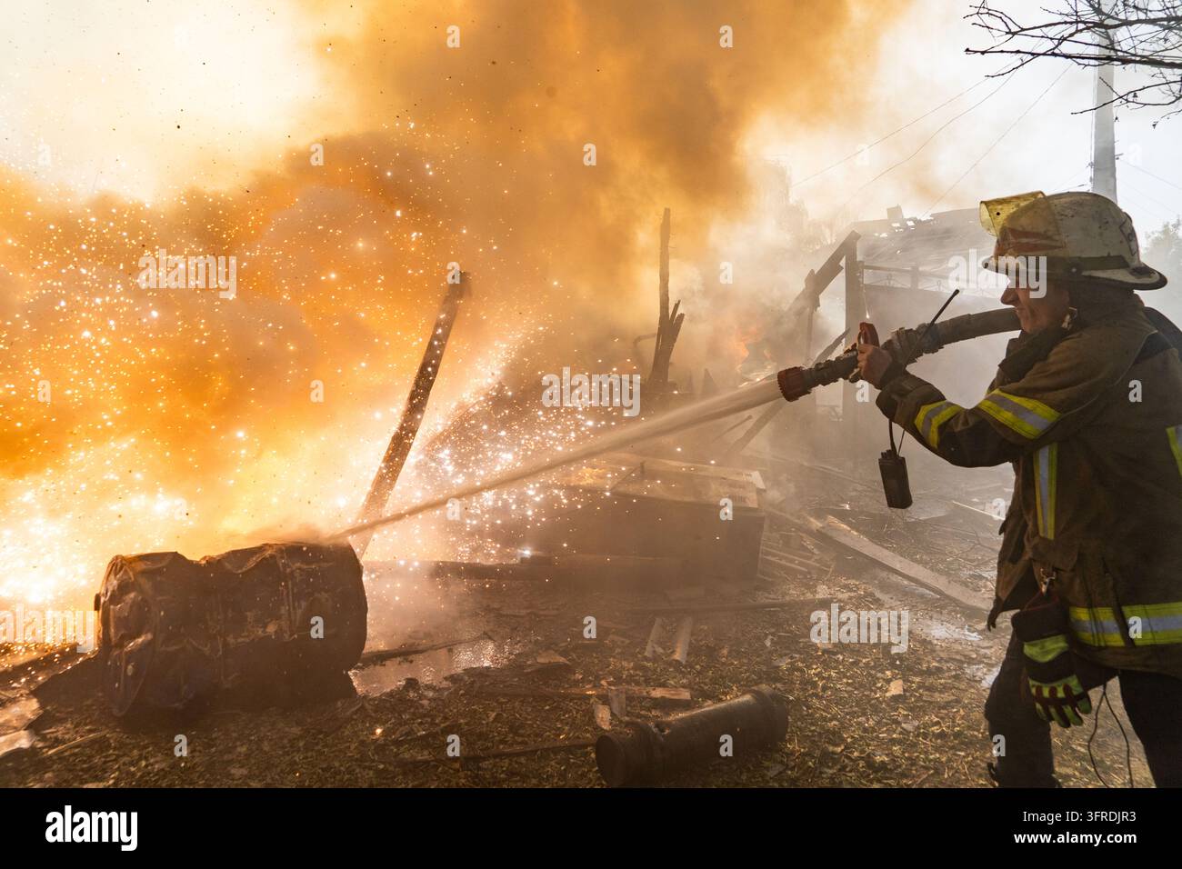File Rescue Software A rescue worker puts out a fire at residential houses destroyed in a ...