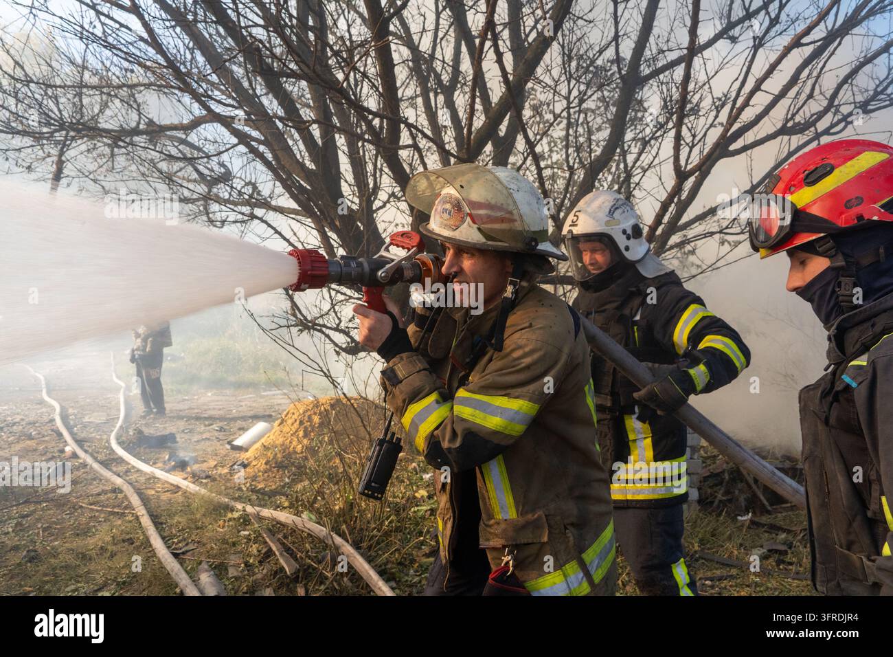 File Rescue Software Rescue workers put out a fire at residential houses destroyed in a ...