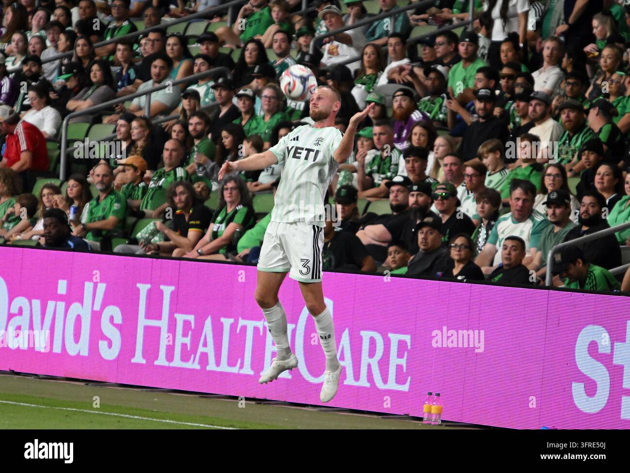 AUSTIN, TX - October 10: Austin FC defender Mikkel Desler heads a ball ...