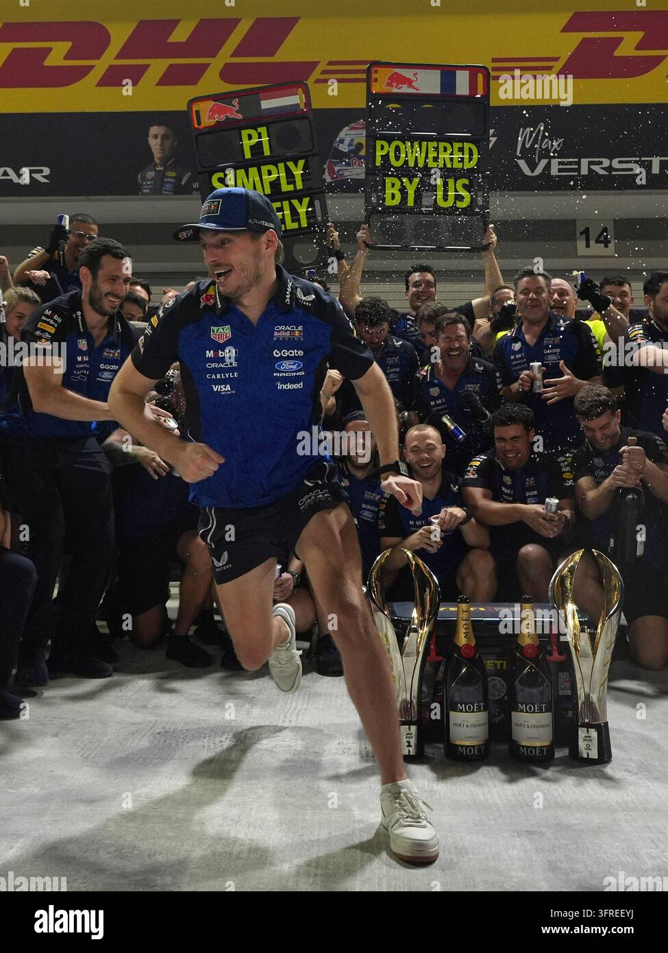 Water Races Formula Red Bull driver Max Verstappen of the Netherlands, runs to avoid spray ...