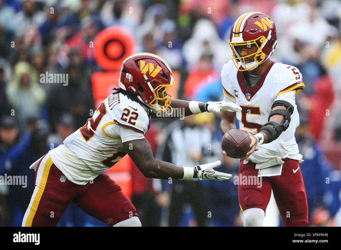 Washington Commanders New Roster Washington Commanders quarterback Jayden Daniels (5) hands the ball to ...