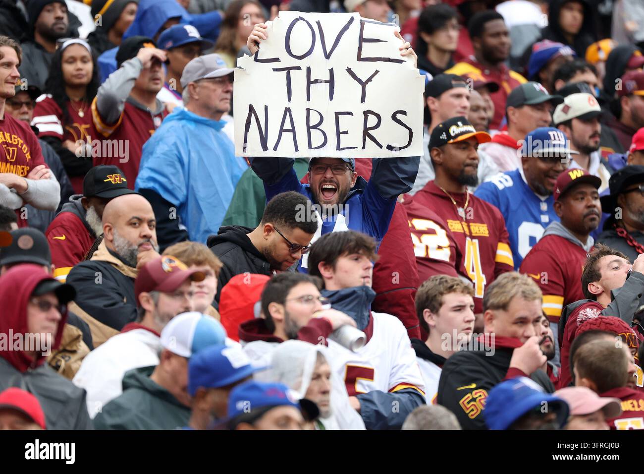 Commanders Vector A New York Giants fan celebrates during an NFL football game against ...