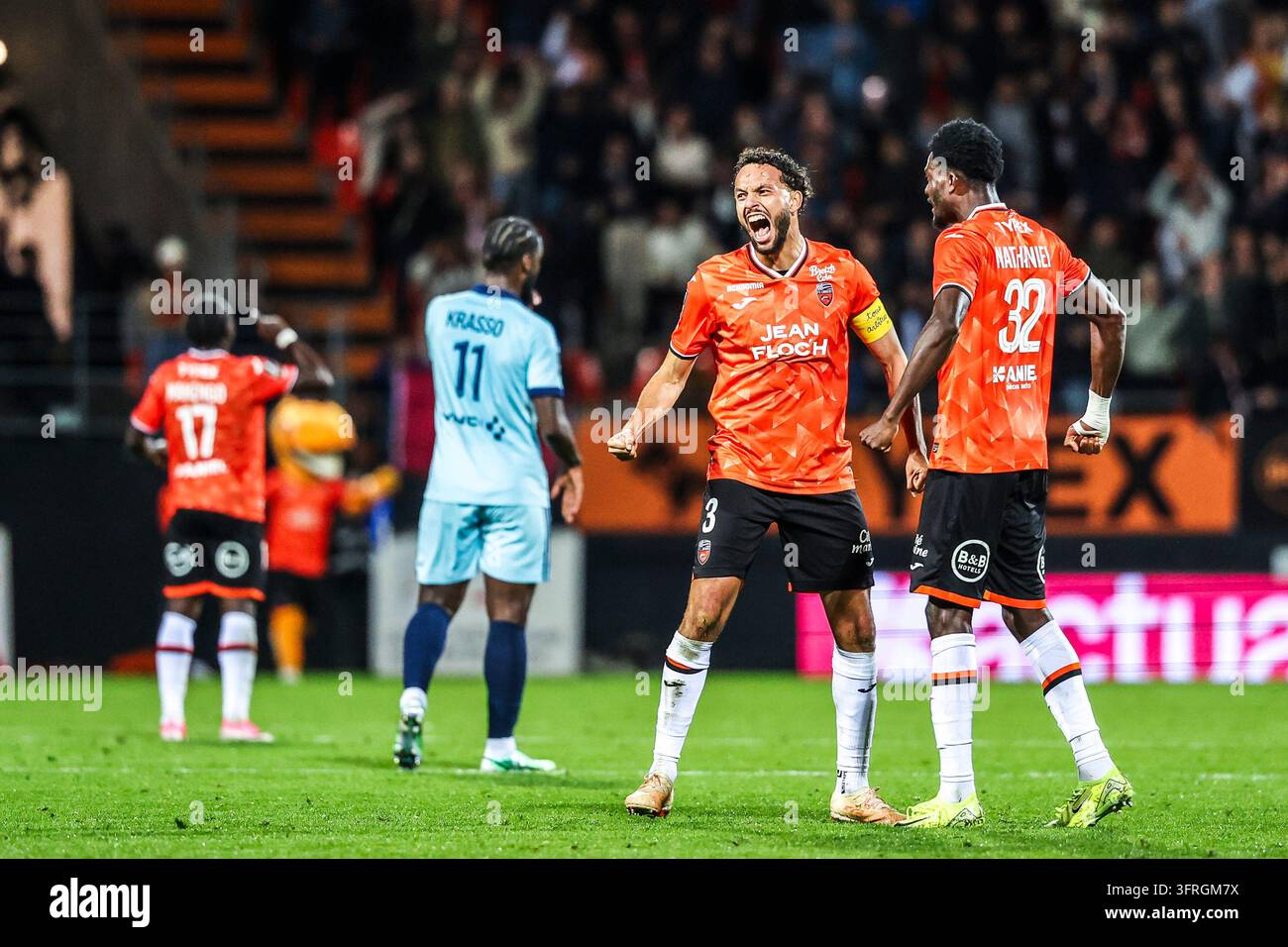 Montassar TALBI and Nathaniel ADJEI of Lorient celebrates the victory ...