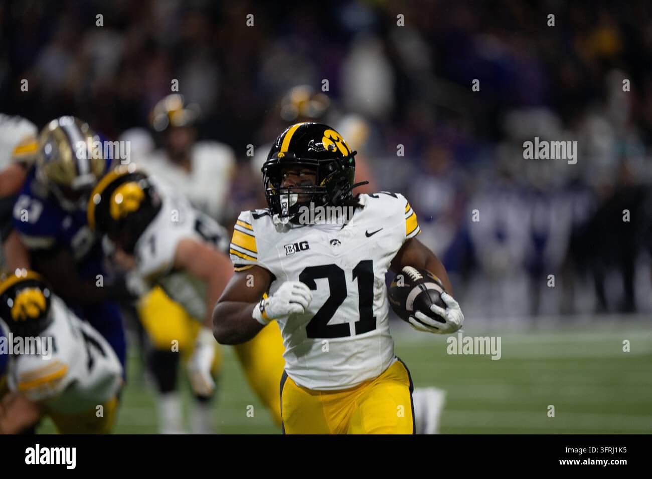 Iowa runningback L.J. Phillips Jr. runs with the ball during an NCAA ...