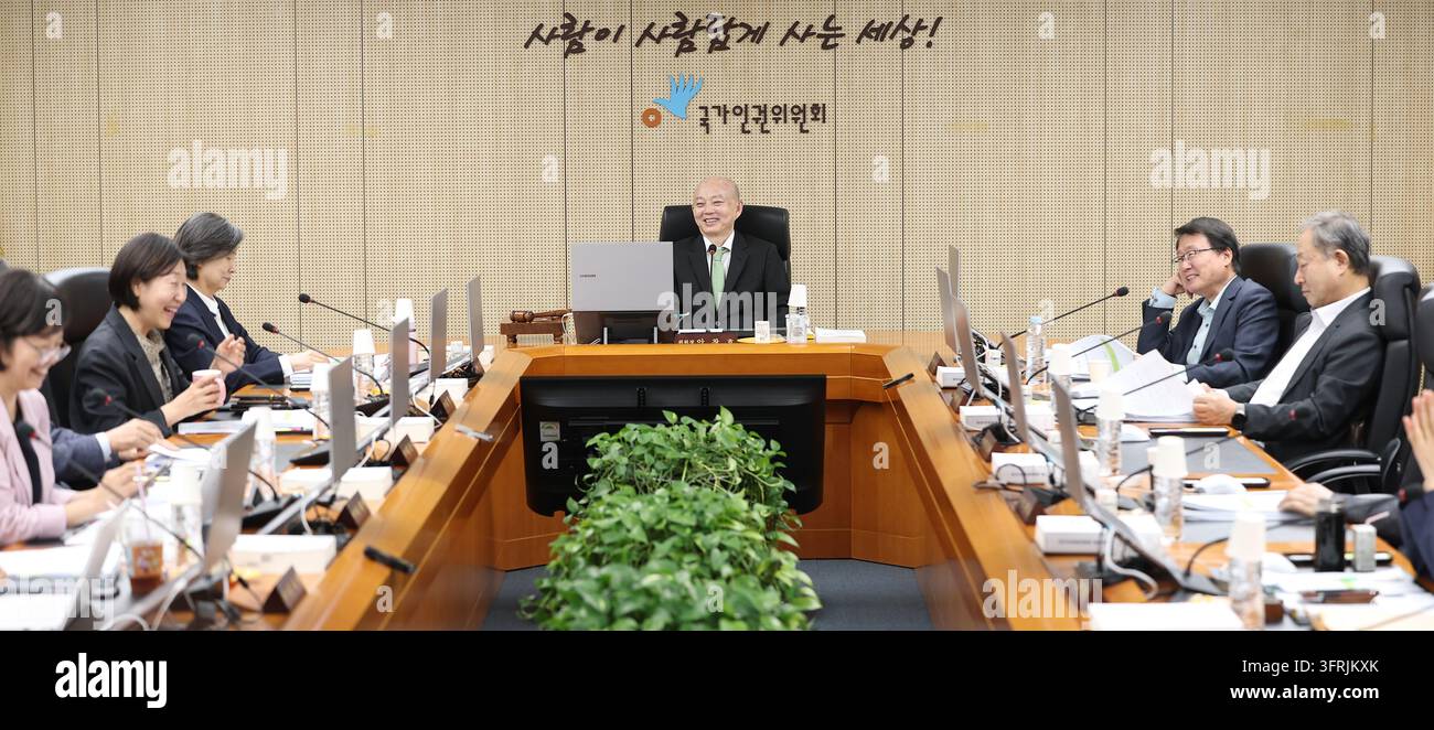 State-run human rights body's chief Ahn Chang-ho (C, rear), chairman of ...