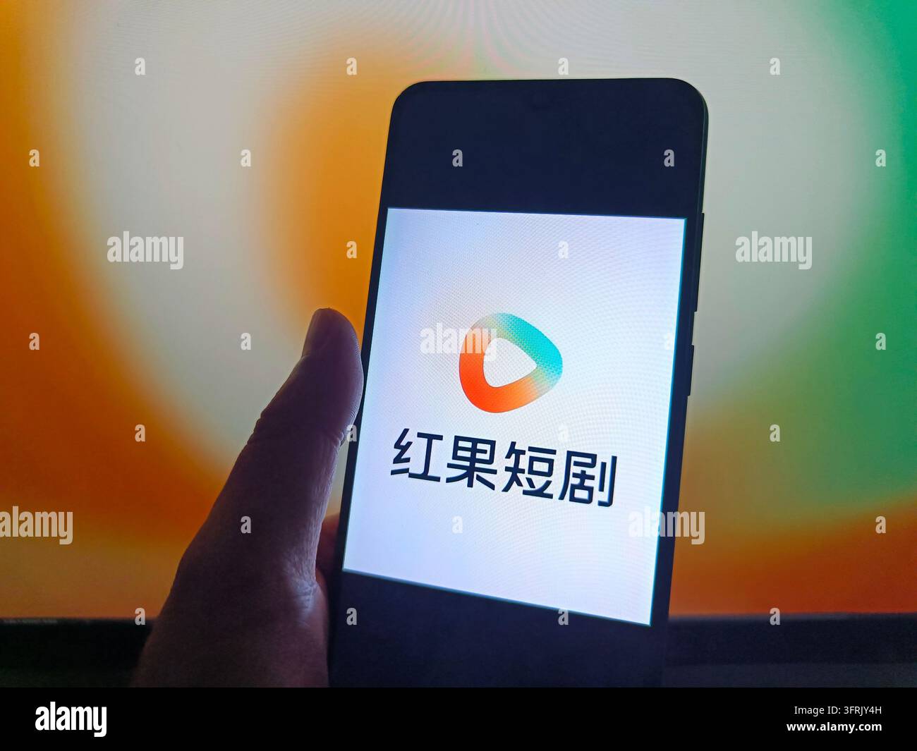 SUQIAN, CHINA - OCTOBER 12, 2026 - A netizen is using his mobilephone ...