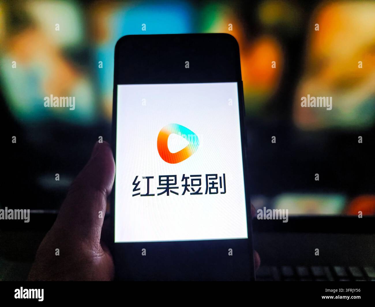 SUQIAN, CHINA - OCTOBER 12, 2026 - A netizen is using his mobilephone ...