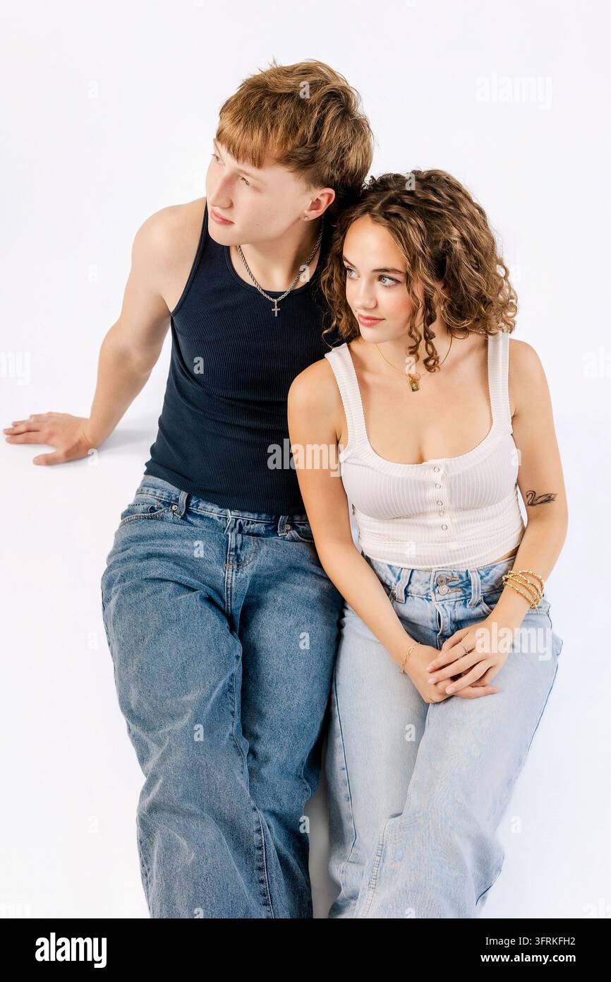 Stylish Gen Z couple posing on a white background Stock Photo