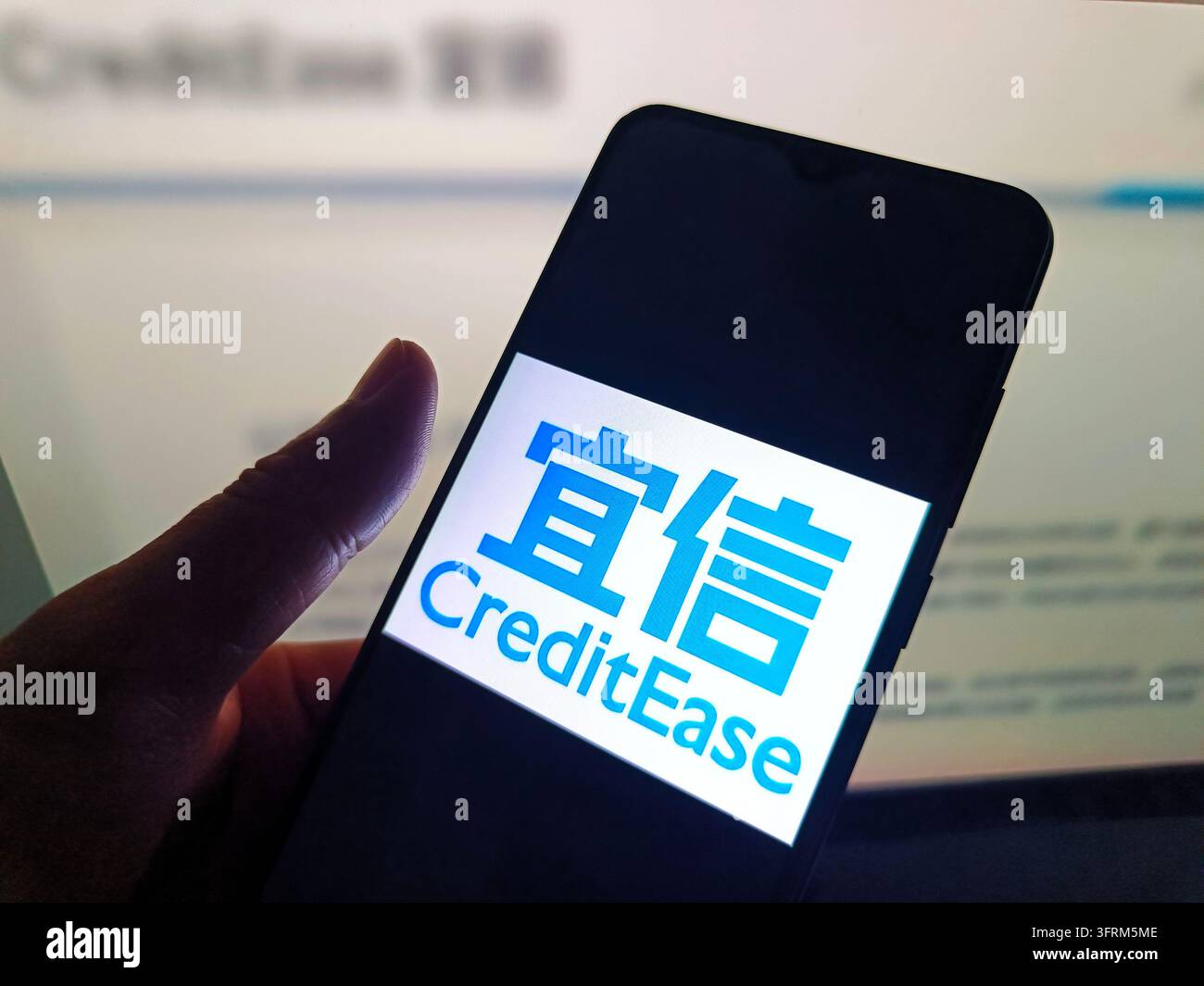 SUQIAN, CHINA - OCTOBER 12, 2026 - A netizen is using his mobilephone ...