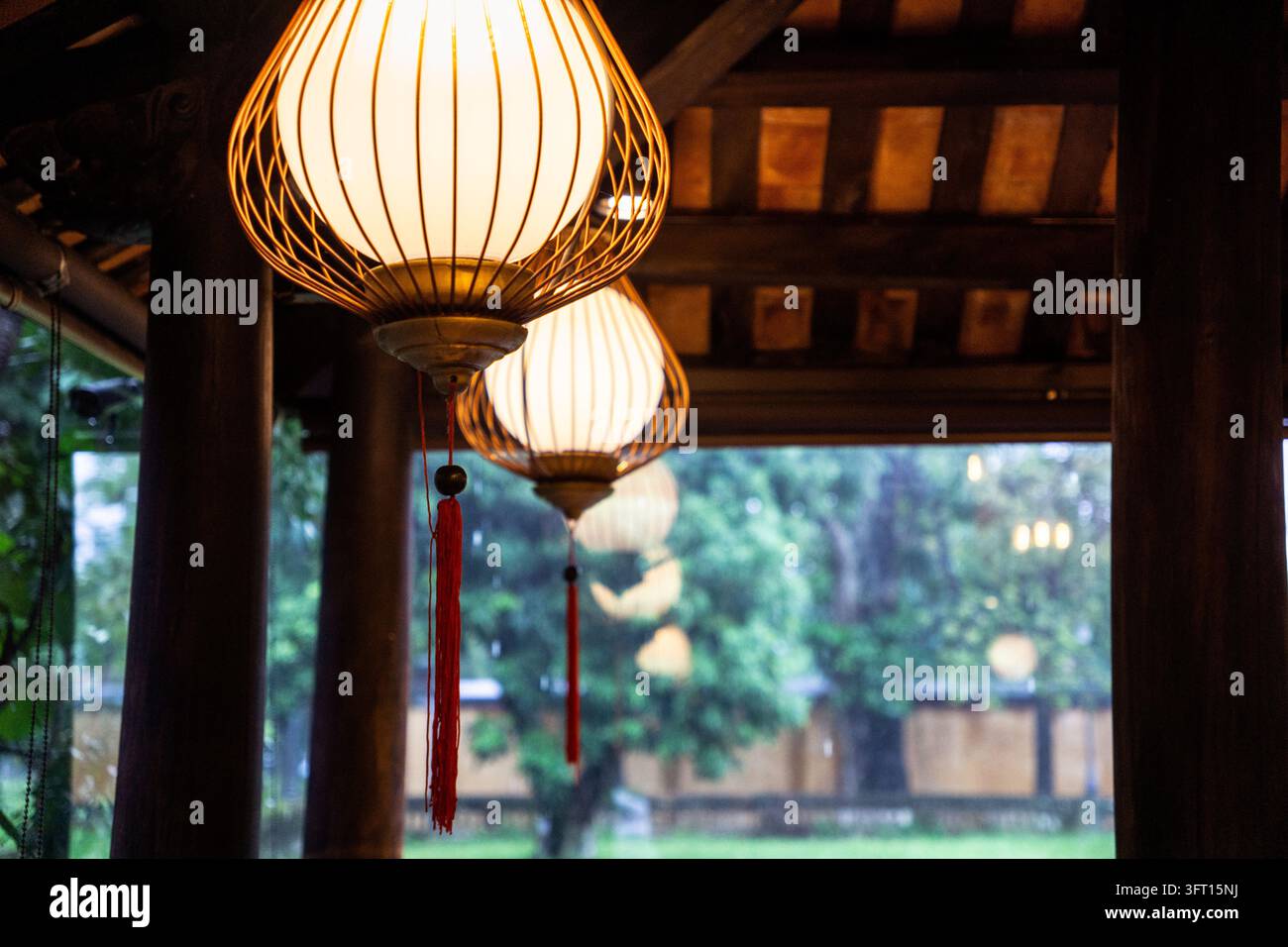 Lantern style ceiling lights inside a traditional building in Asia Stock Photo
