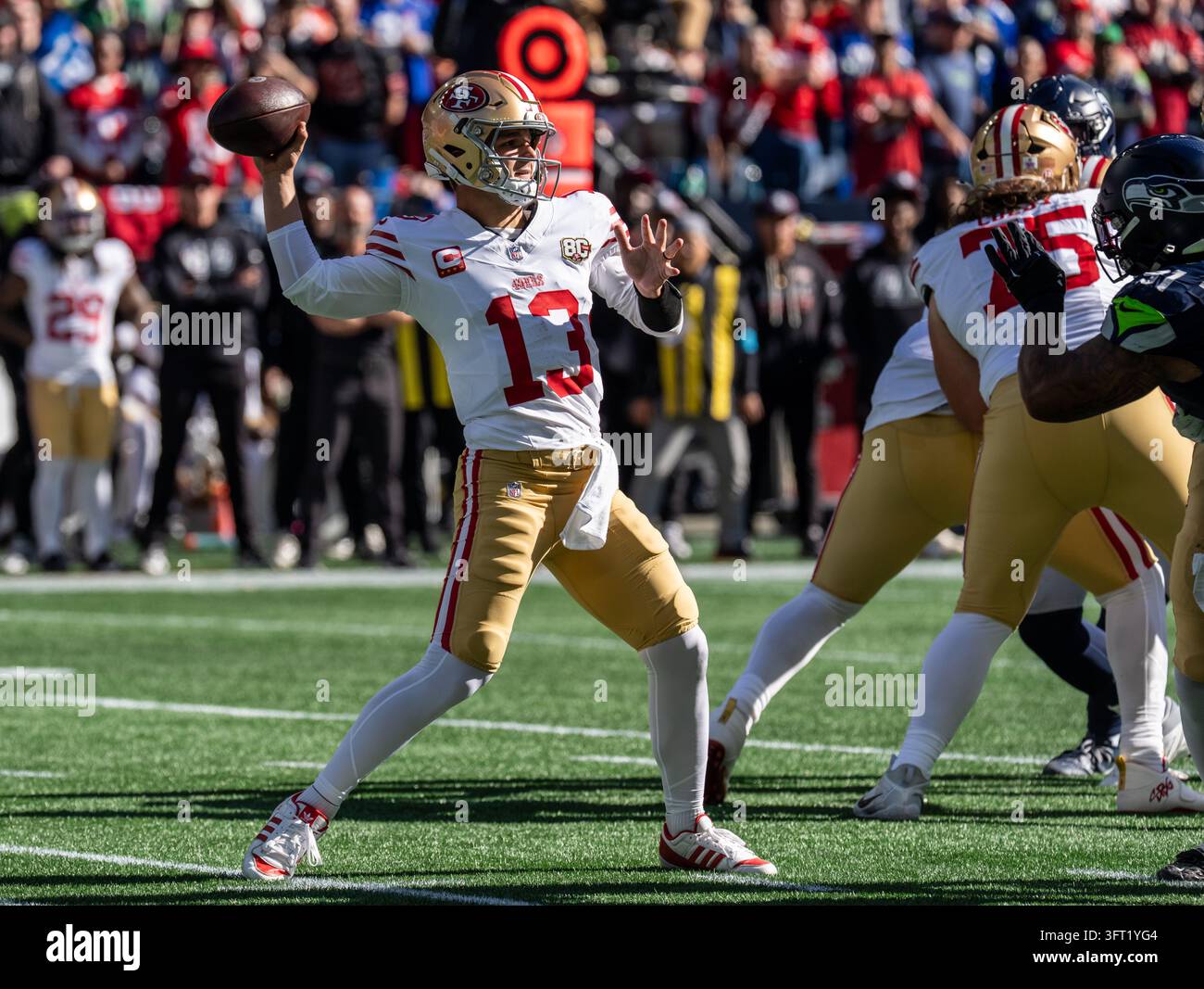 San francisco quarterback brock purdy passes the ball during an nfl football game against the seattle seahawks in seattle sun