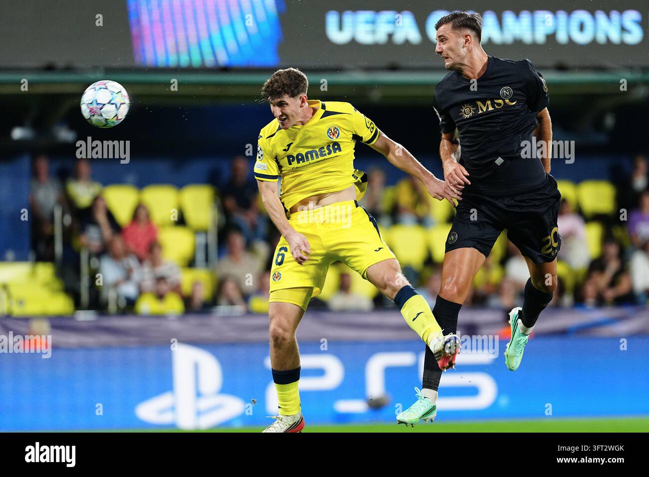 Villarreal's Pau Navarro, left, and Napoli's Lorenzo Lucca challenge ...