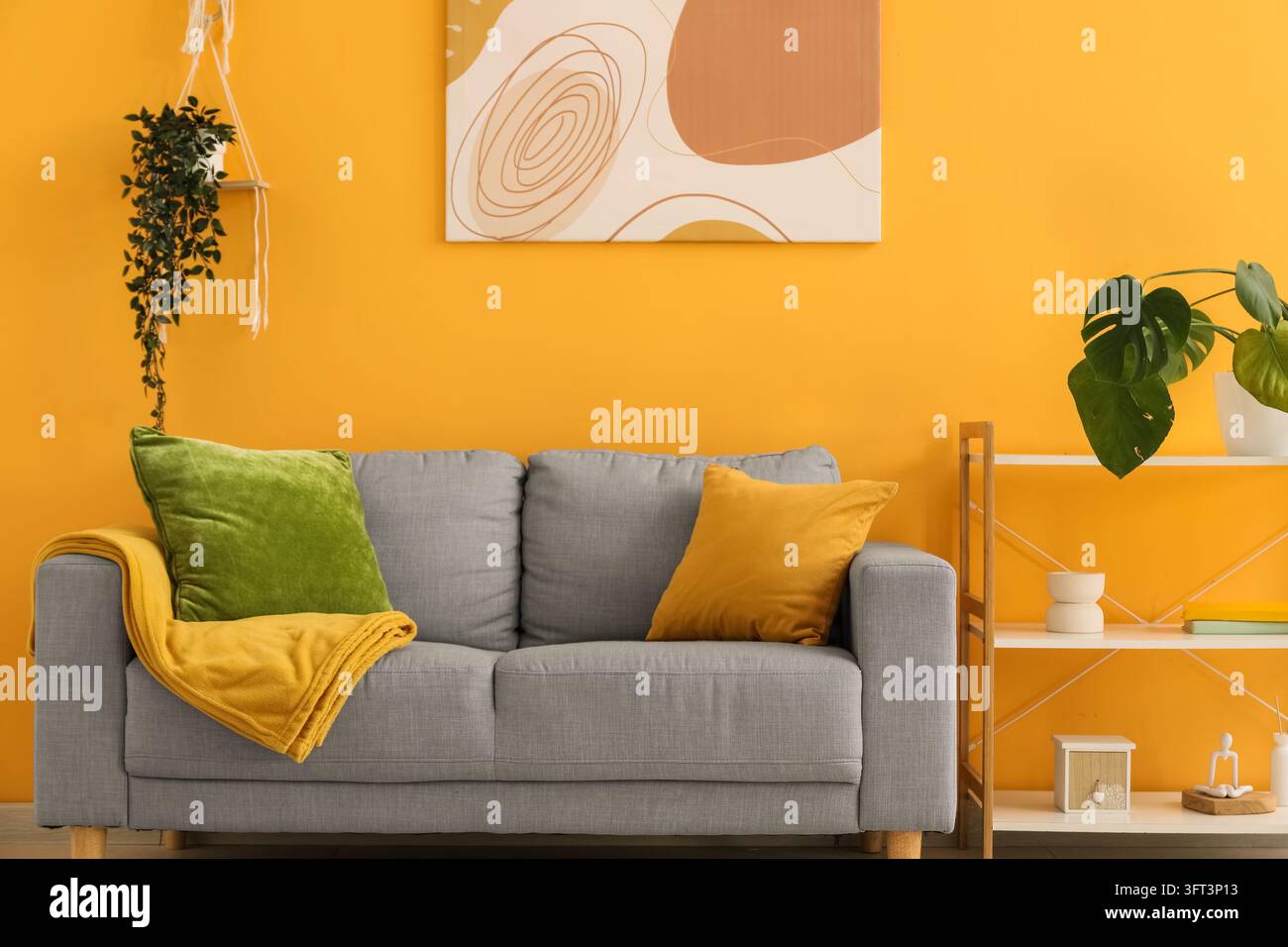Interior design and home comfort, modern living room with grey sofa and ...