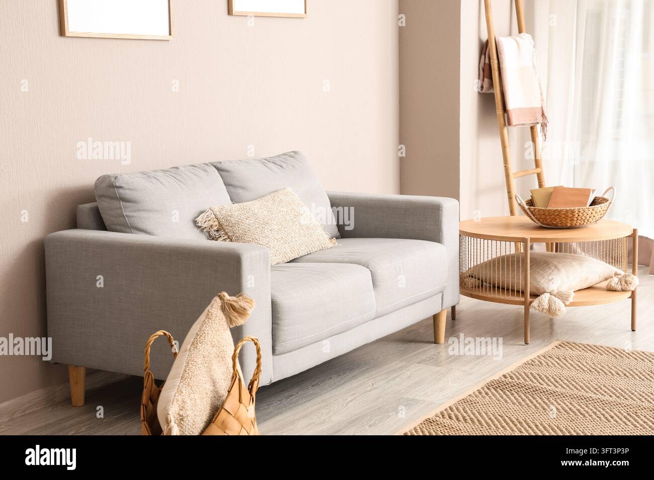 Interior design and home comfort, cozy living room with grey sofa and ...