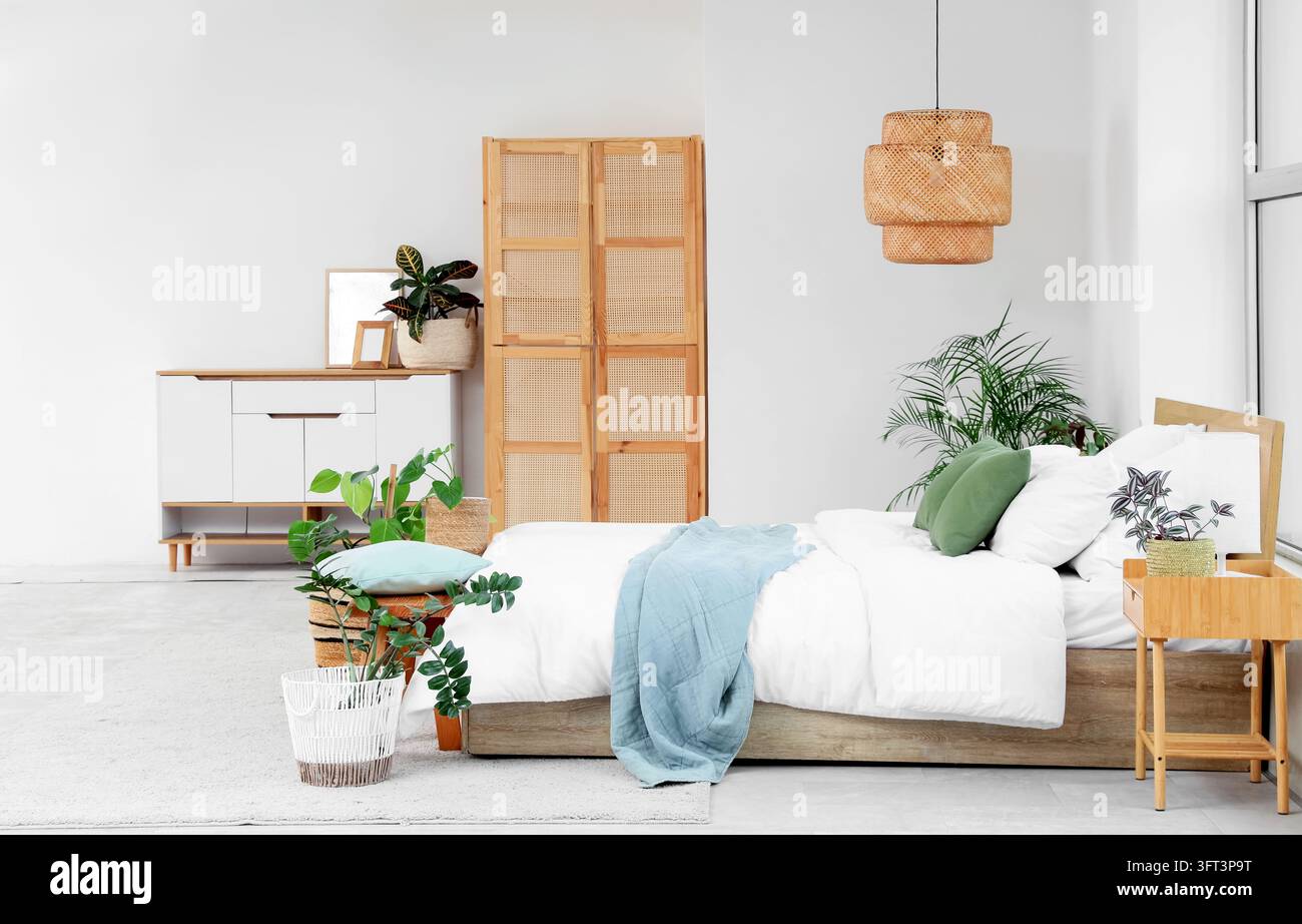 Interior design and home comfort, modern bedroom with rattan furniture ...