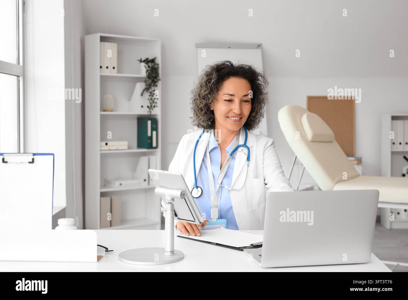 Telemedicine and remote healthcare, female doctor using laptop and ...