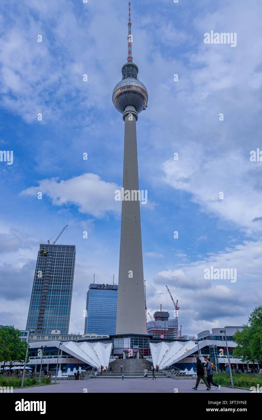 The Berlin TV Tower rises above its entrance pavilion and angular base ...