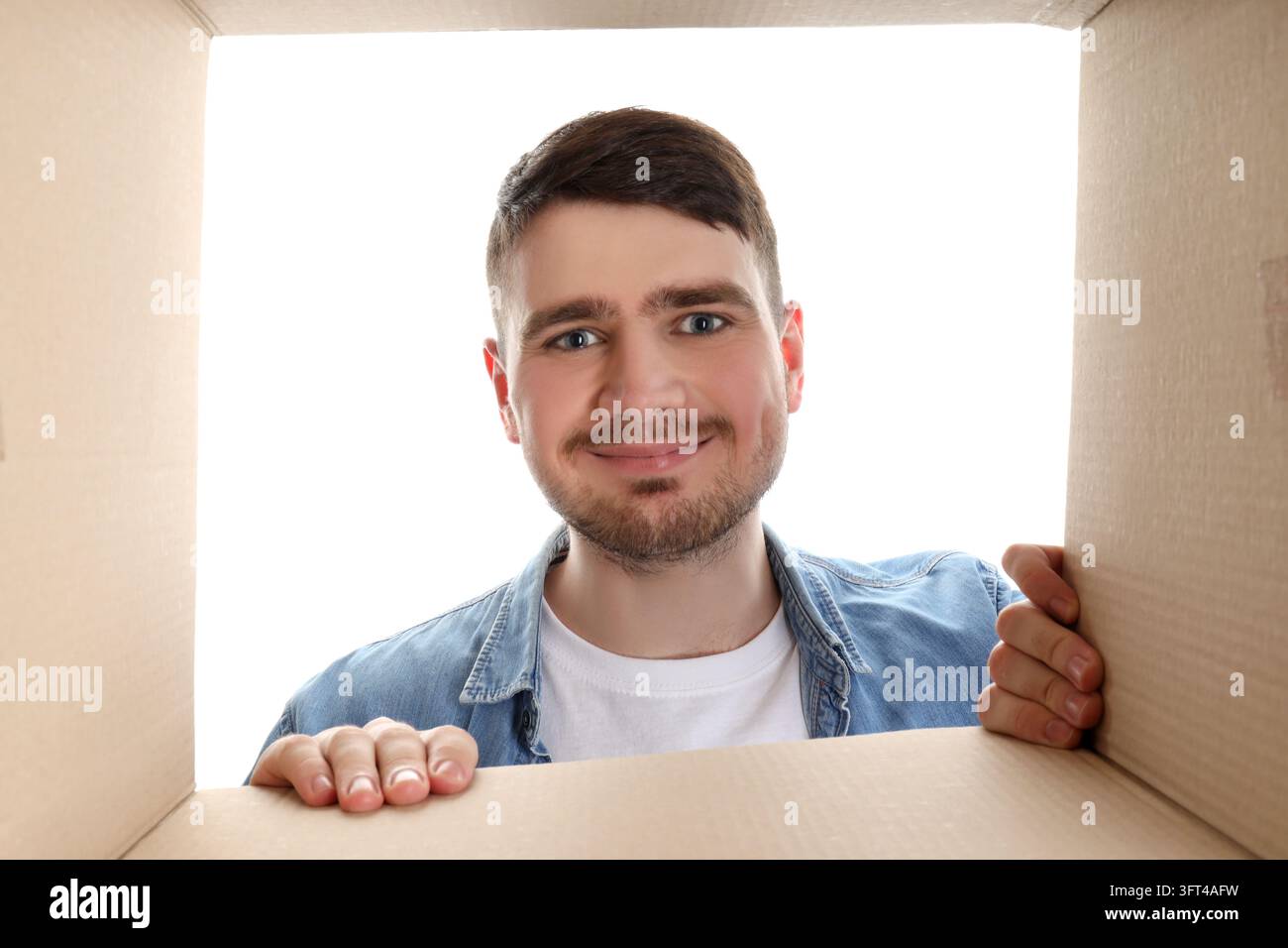 Concept of delivery, gift, surprise, young man and cardboard box ...