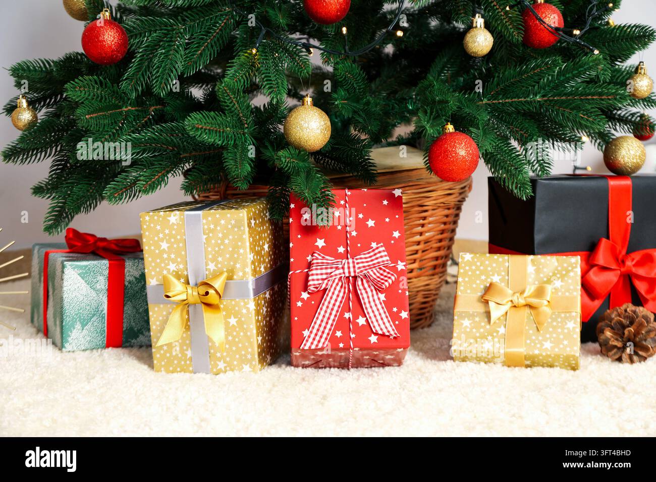 Christmas tree with beautiful different gift boxes Stock Photo - Alamy