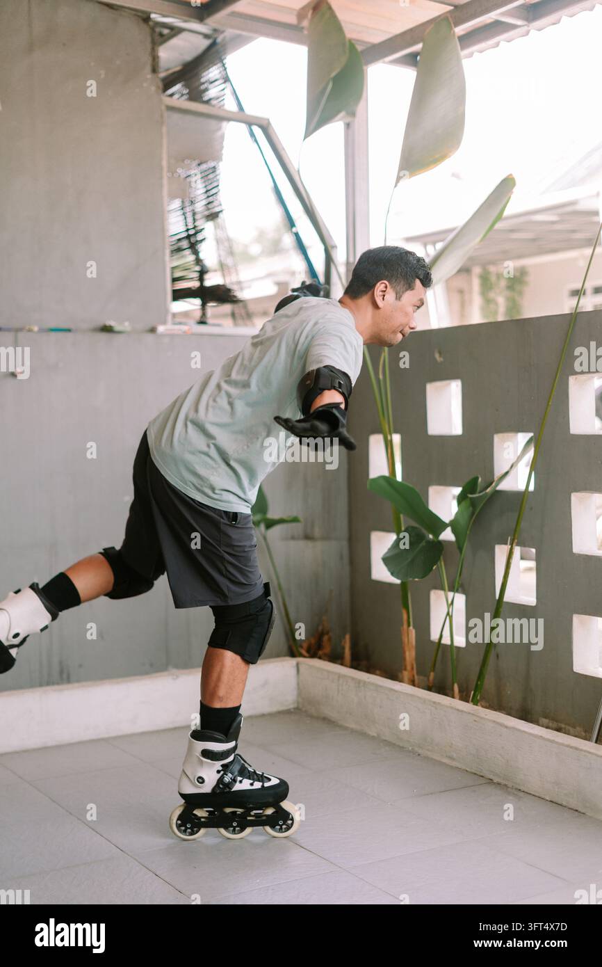 A person practicing inline skating wearing protective gear on an ...