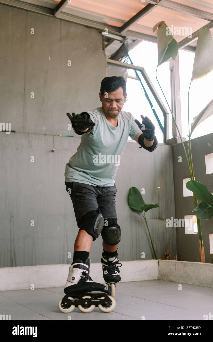 A person wearing protective gear practices inline skating balance on a ...