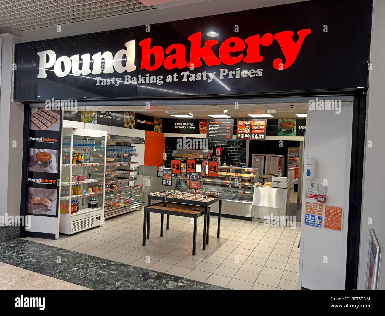 Poundbakery low-cost bakery shop frontage in a shopping centre in Skelmersdale. Stock Photo