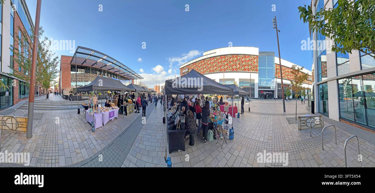 Makers Market trading in Warrington's Time Square with stalls and people outside the market building. Stock Photo