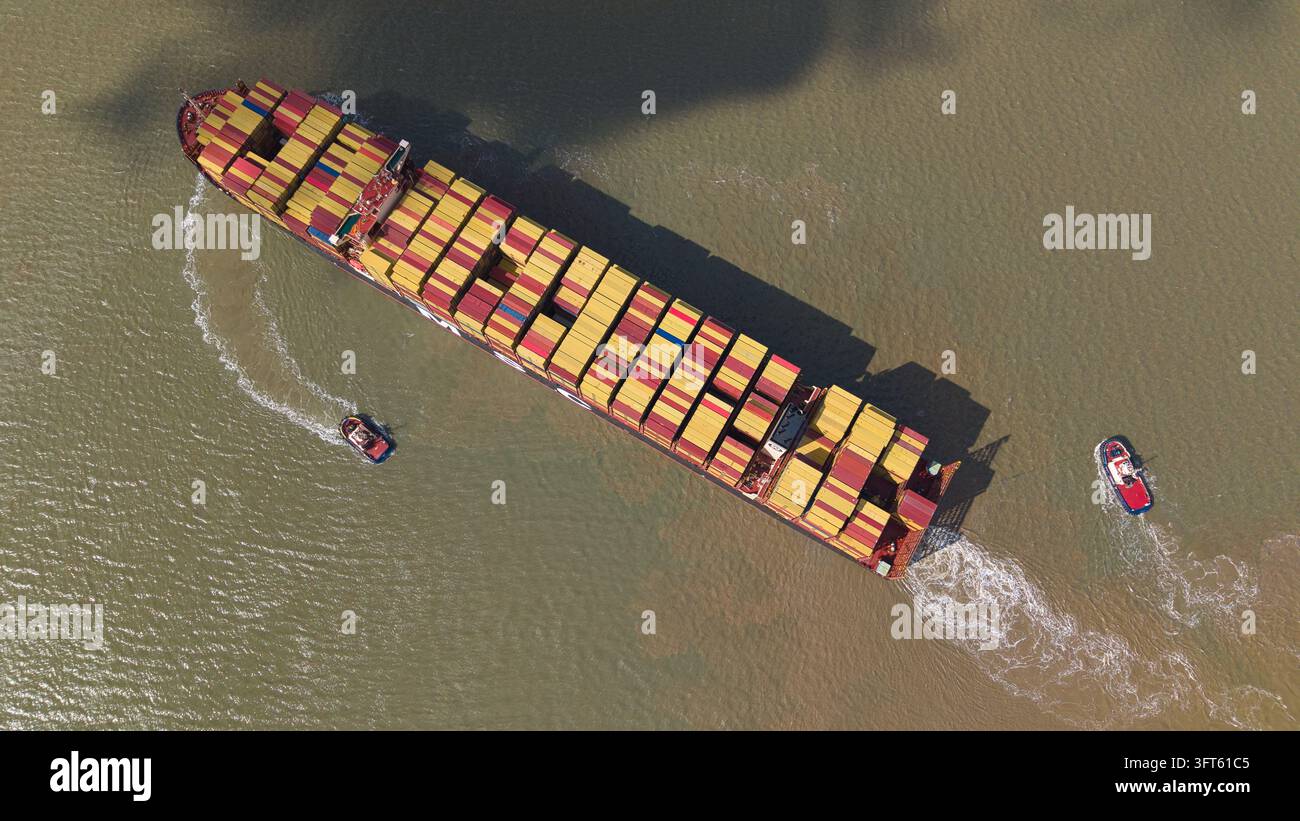 Large cargo ship escorted two hi-res stock photography and images - Alamy