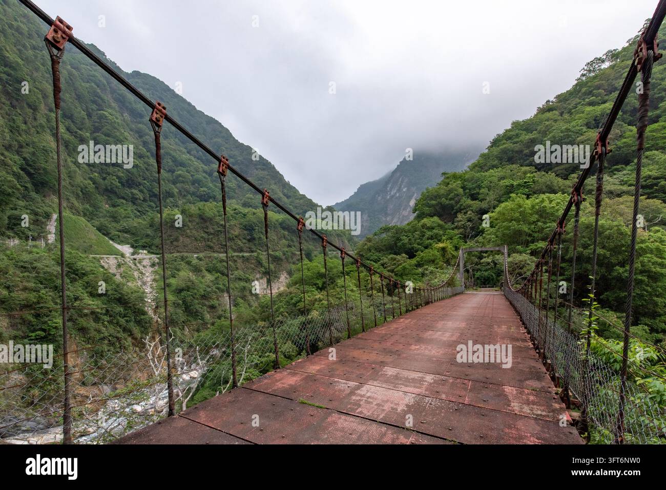 View of the suspension bridge at Taroko National Park with metal ...