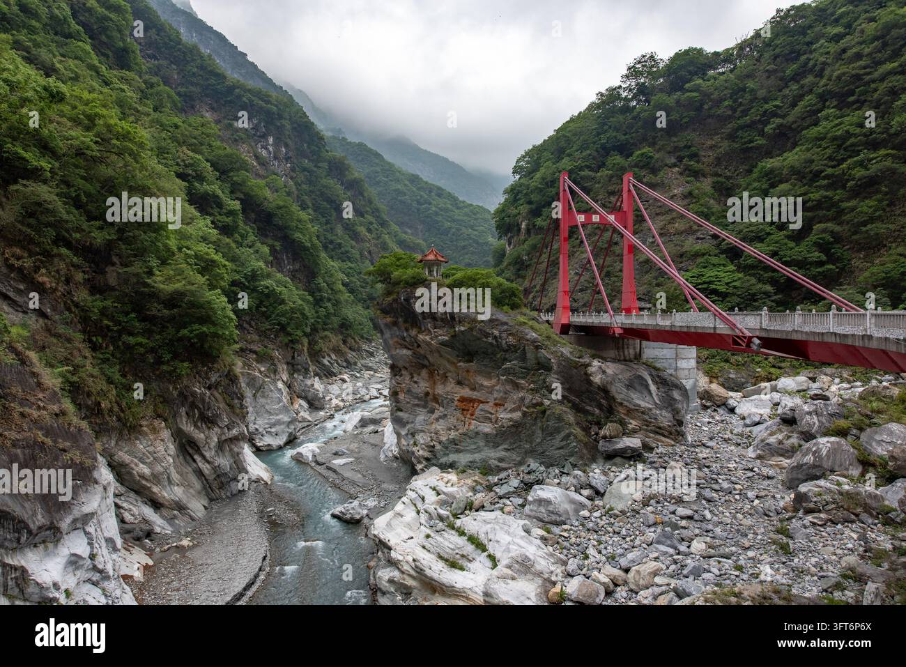 View of the red Changchun Bridge spanning the rocky gorge in Taroko ...