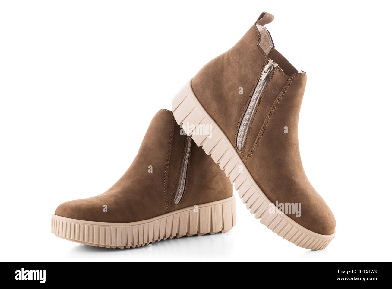 Pair of brown suede Chelsea boots with platform sole isolated on white ...