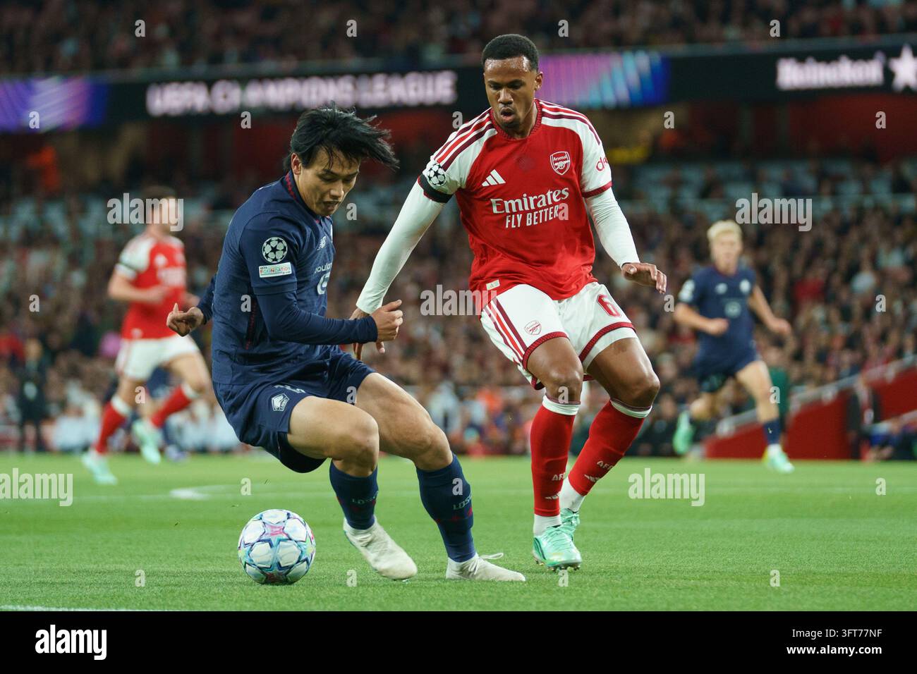 Ayase Ueda of Lille under pressure from Gabriel of Arsenal during ...