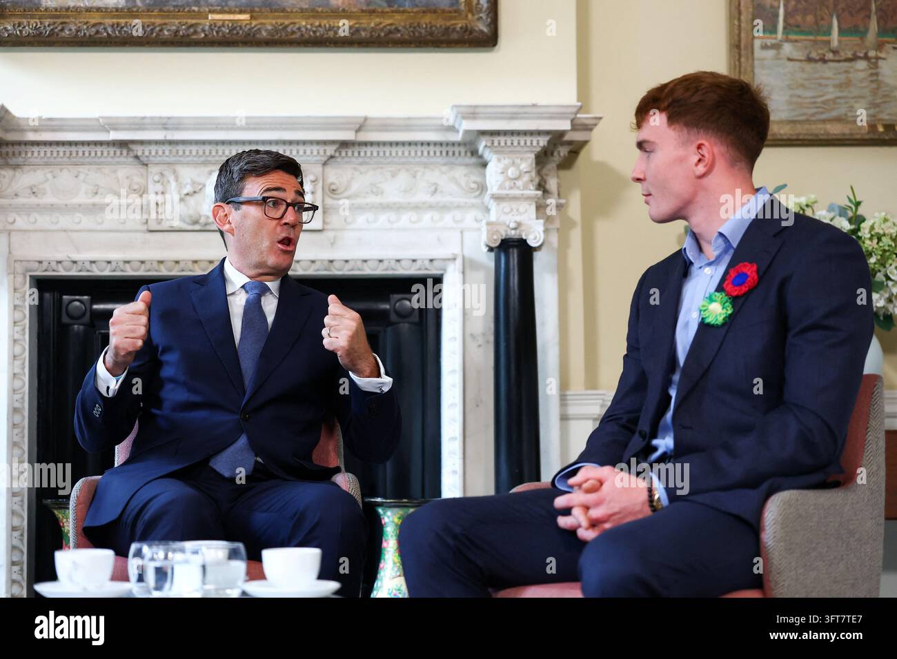 Britain's Prime Minister Andy Burnham, left, meets swimmer and cancer ...