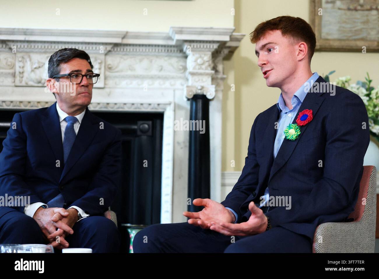 Britain's Prime Minister Andy Burnham, left, meets swimmer and cancer ...