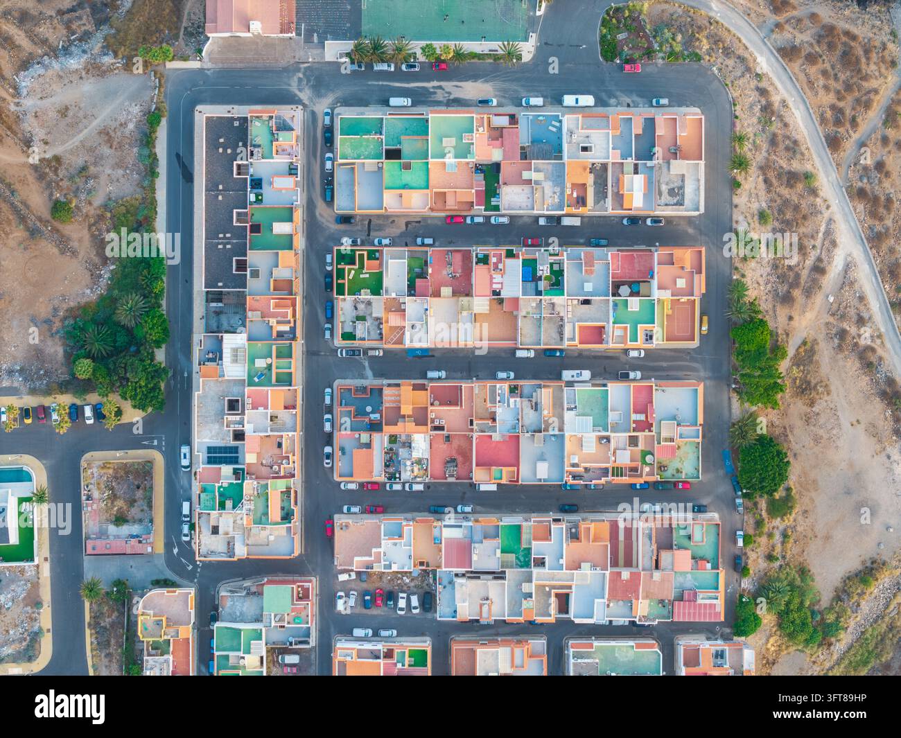 Aerial view of a residential neighborhood with colorful rooftops ...
