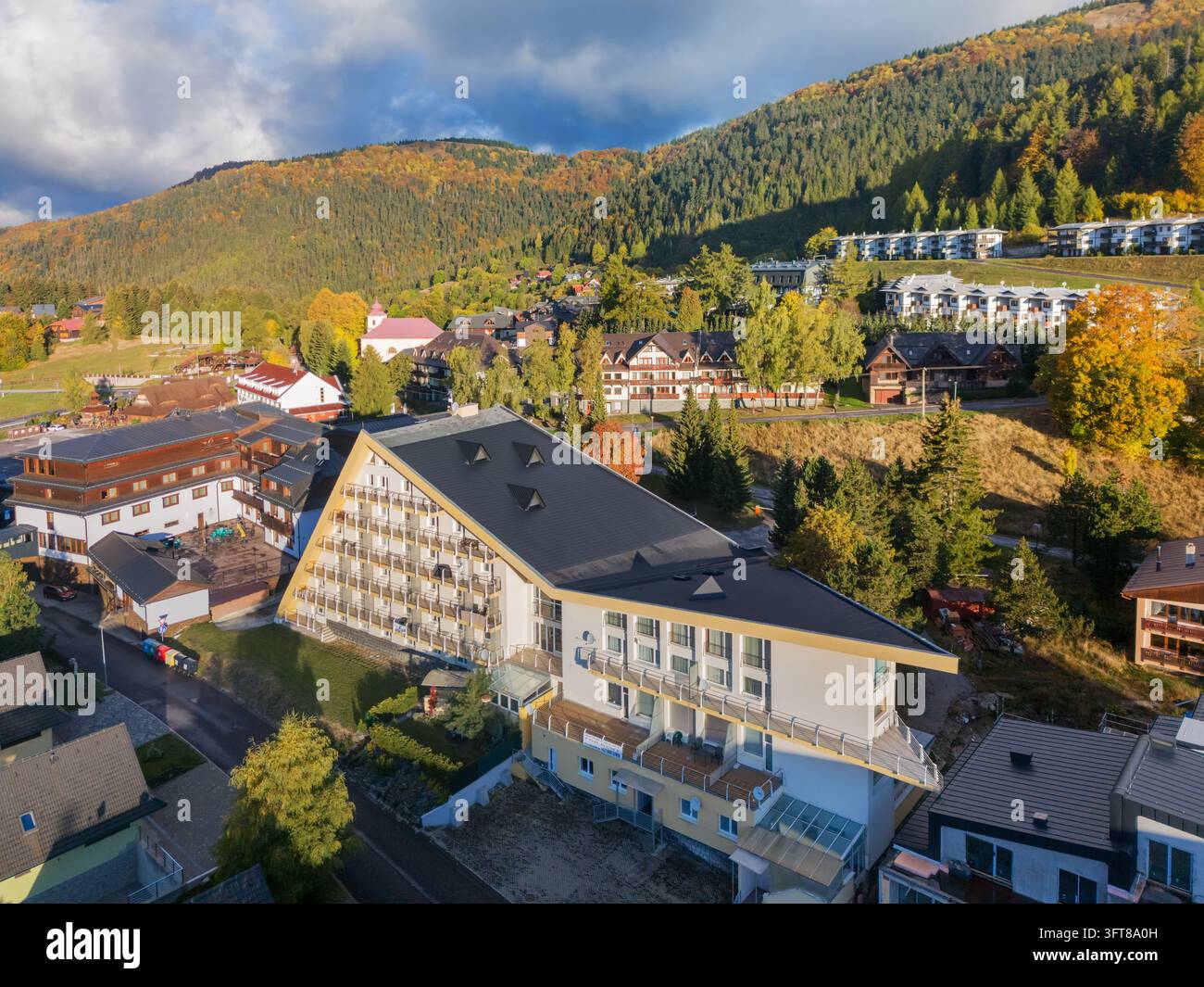 Aerial view of the Donovaly resort featuring a modern hotel with an ...