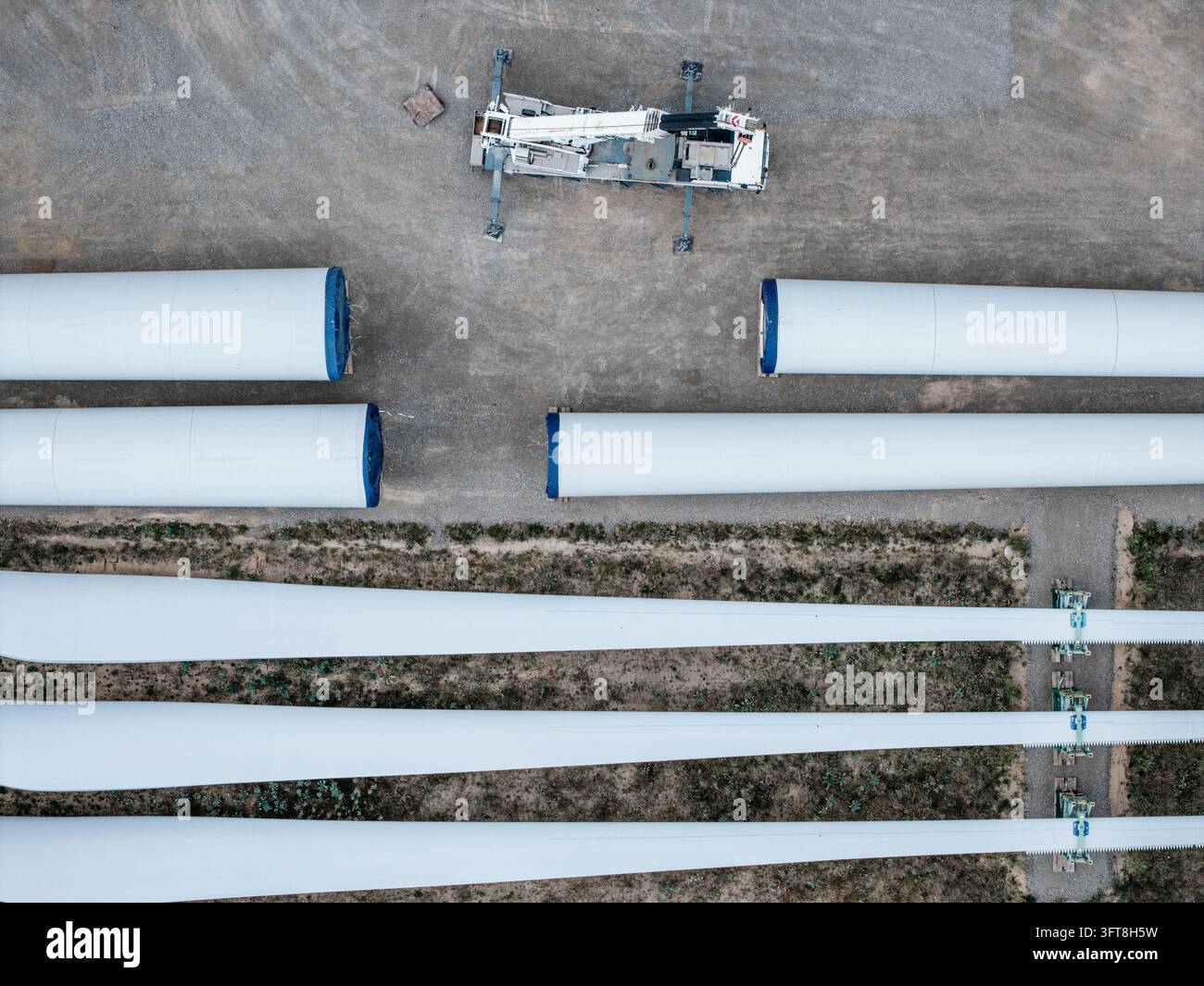 Aerial view of wind turbine components including rotor blades and tower ...