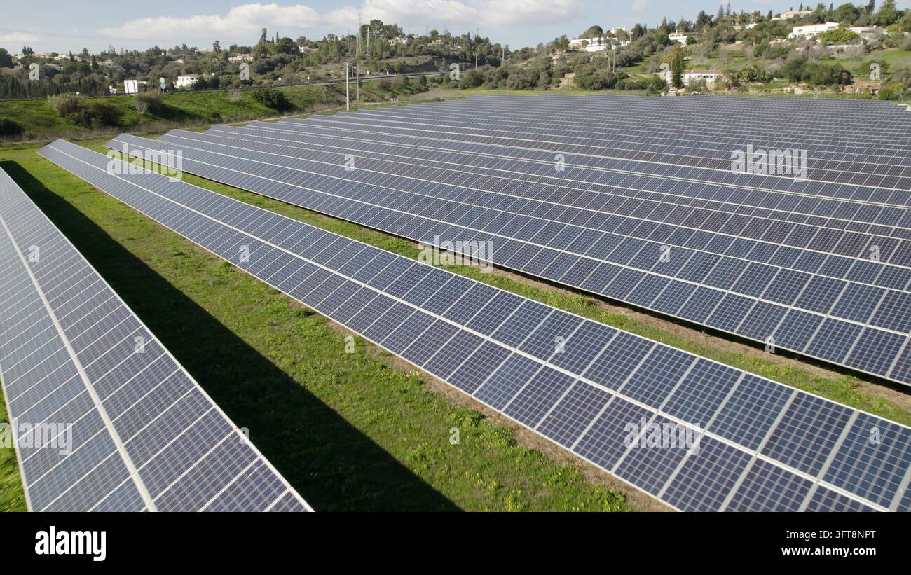 Solar Field Computer Background Aerial view of a large solar farm with rows of photovoltaic panels ...