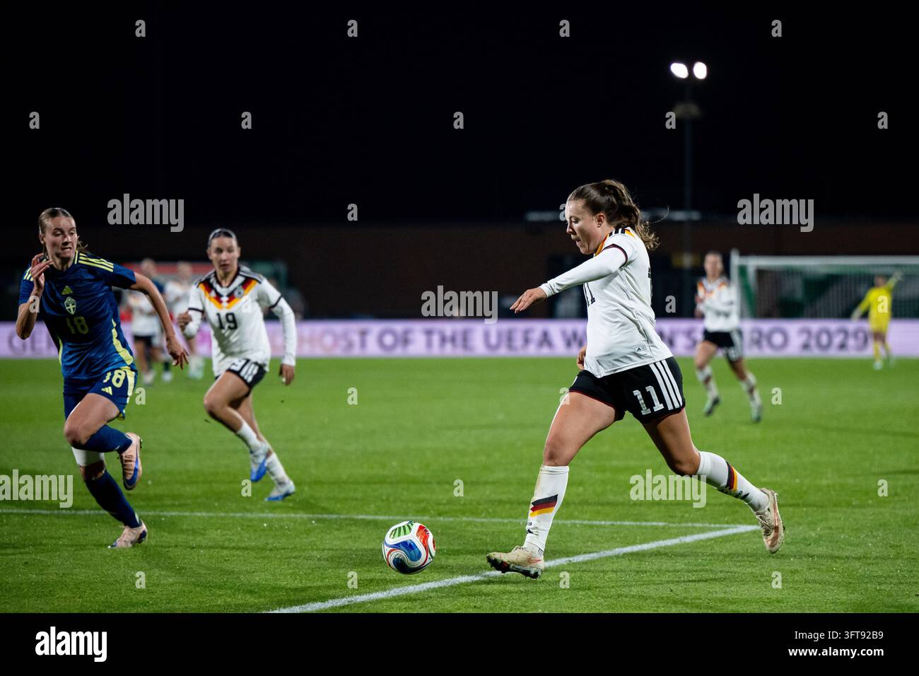 Mara Alber (Germany, #11) on the ball, next to Julia Ragnarsson (Sweden ...