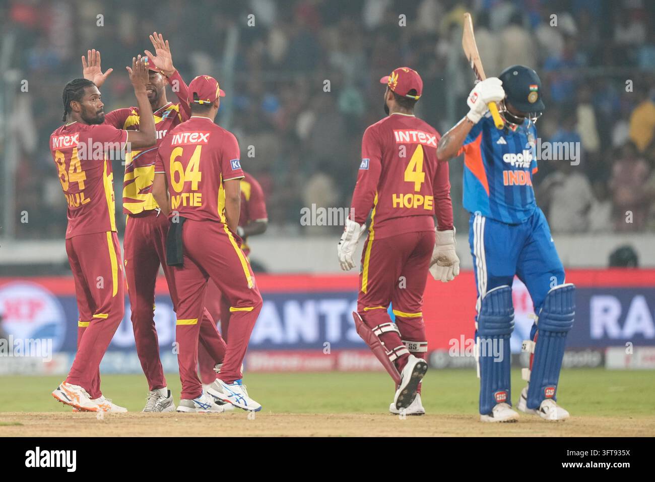Kumar Raddy West Indies' Keemo Paul, left, celebrate with teammates the wicket of ...