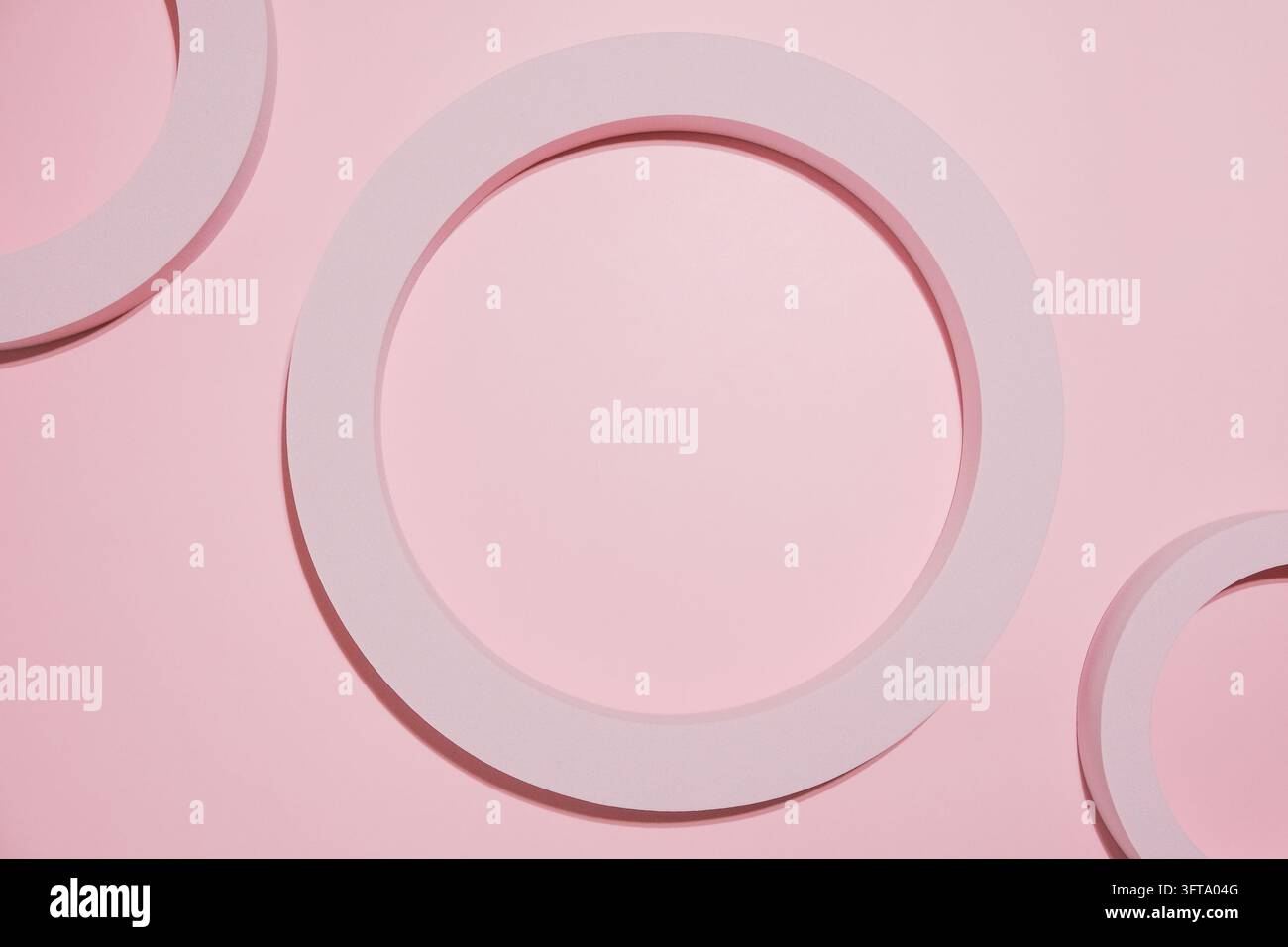 Abstract pink geometric composition with circular forms on pastel ...