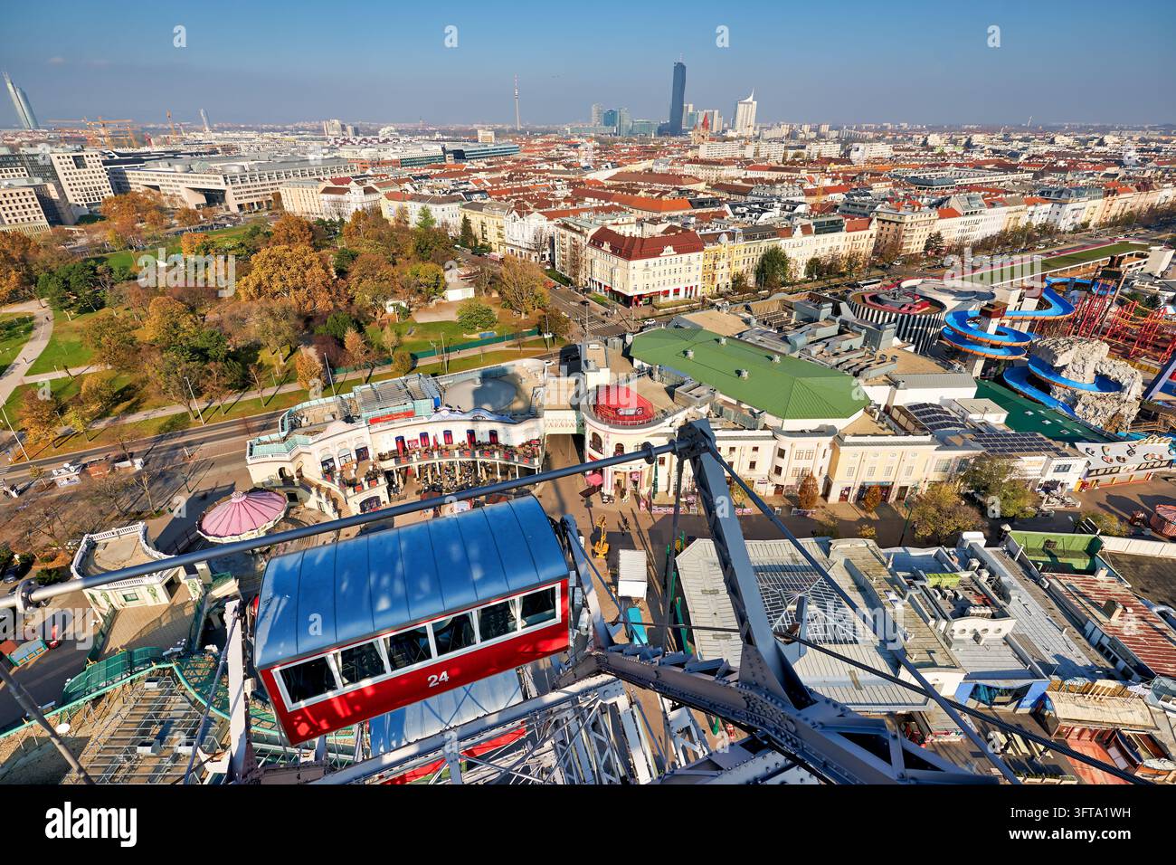 Red cabin of the Giant Ferris Wheel over the Wurstelprater amusement ...