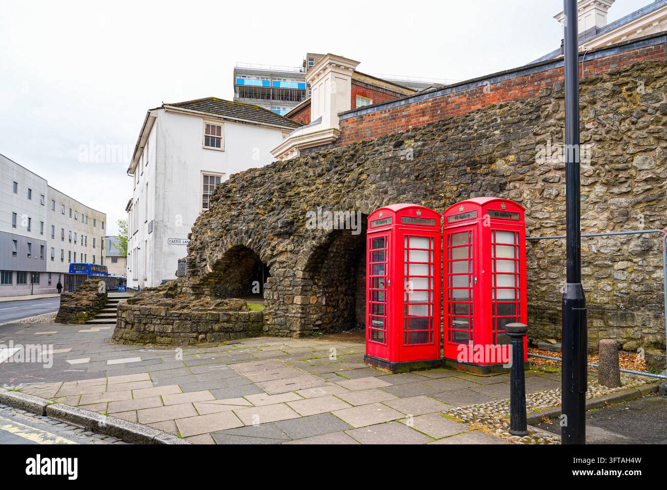 Iconic British red telephone box near Castle Gate and medieval wall ...