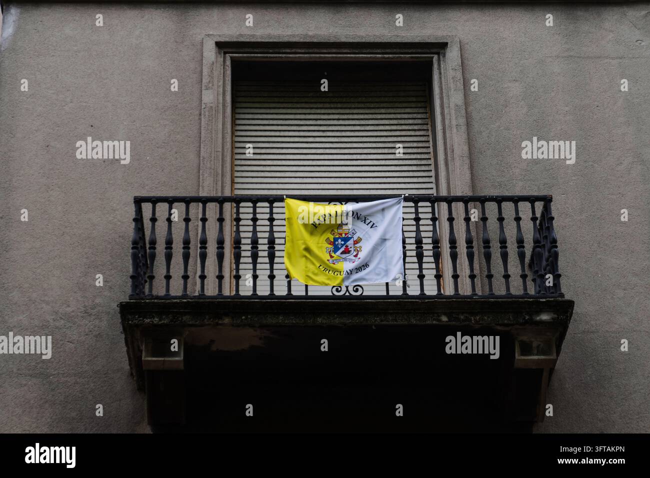 A flag bearing the Vatican’s colors and promoting Pope Leo XIV’s ...