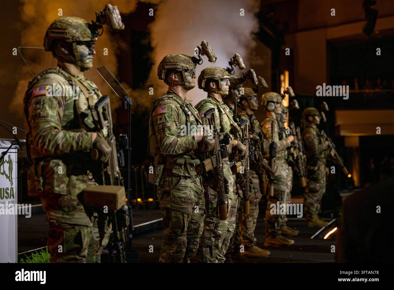 Soldiers stand at attention after a speech by Adam Telle, Acting ...